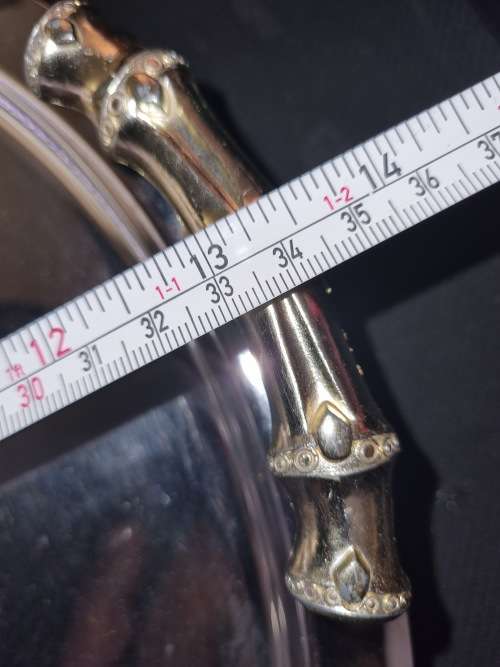A NEAT VINTAGE STAINLESS STEEL AND BRASS HANDLED SERVING TRAY SOLD AS IS