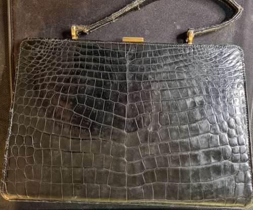 A genuine used black ostrich skin tote handbag