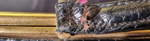 A genuine used black ostrich skin tote handbag