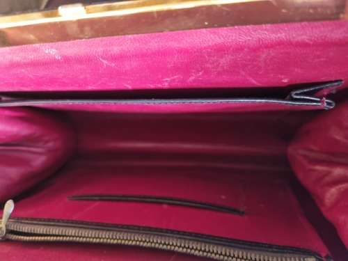 A genuine used black ostrich skin tote handbag