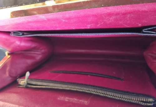 A genuine used black ostrich skin tote handbag