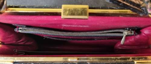 A genuine used black ostrich skin tote handbag