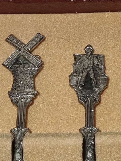 A COLLECTORS SET NICKEL SILVER TEASPOON SET MADE IN HOLLAND IN ITS ORIGINAL BOX SOLD AS IS