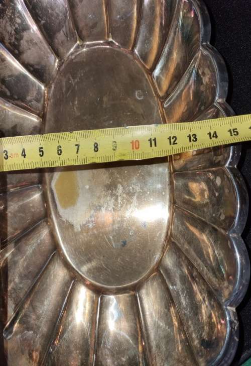 AN OVAL VINTAGE SILVER PLATED SERVING TRAY SOLD AS IS