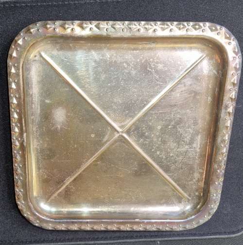 A VINTAGE SILVER-PLATED SERVING TRAY SOLD AS IS