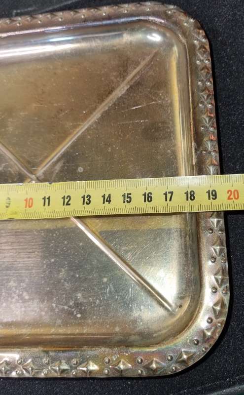 A VINTAGE SILVER-PLATED SERVING TRAY SOLD AS IS