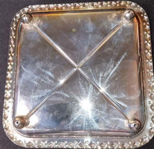 A VINTAGE SILVER-PLATED SERVING TRAY SOLD AS IS