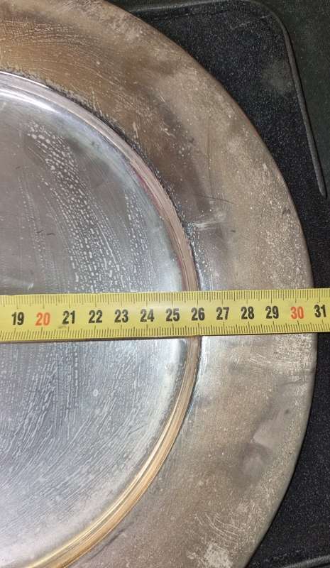 A 31 CENTEMETER DIAMETER SILVER PLATED TRAY SOLD AS IS