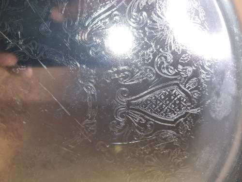 A ROUND STAINLESS STEEL MADE IN HONG KONG SERVING TRAY SOLD AS IS