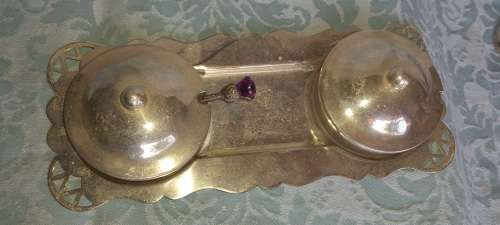 A SILVER PLATED WITH GLASS BOWLS AND A SPOON CONDOMENTS SET