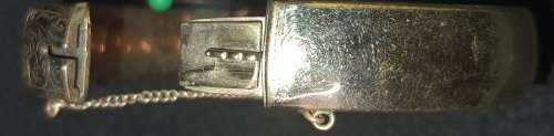 A vintage 9ct gold core bangle 21.8 grs ornately engraved, i