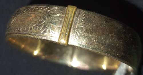 A vintage 9ct gold core bangle 21.8 grs ornately engraved, i