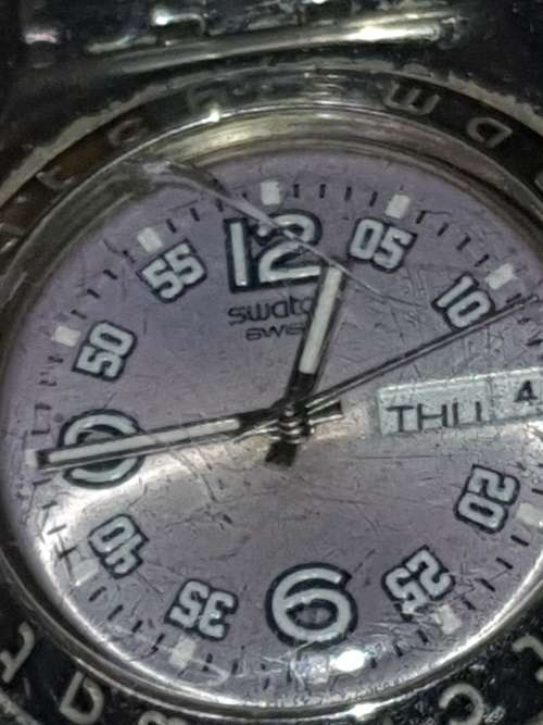 A collection Swatch wrist watches sold as is not tested
