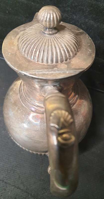 AN ANTIQUE SILVER-PLATED TEA JUG IN GOOD CONDITION ORIGINAL SOLD AS IS
