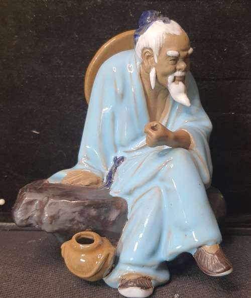 A HAKATA FIGURINE SOLD AS IS