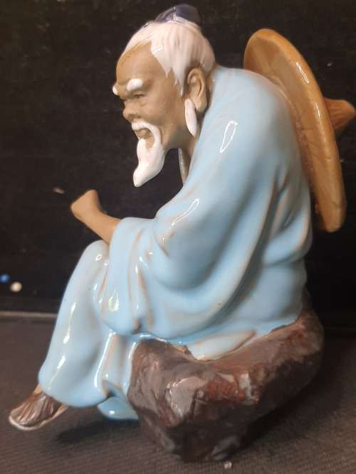 A HAKATA FIGURINE SOLD AS IS