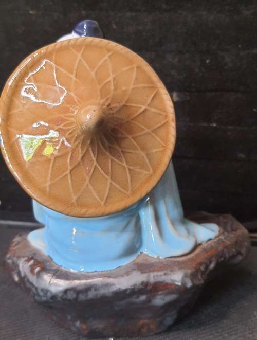A HAKATA FIGURINE SOLD AS IS