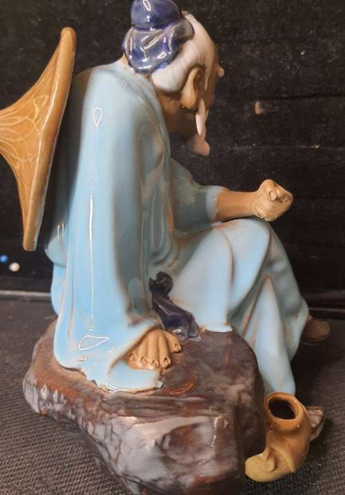 A HAKATA FIGURINE SOLD AS IS