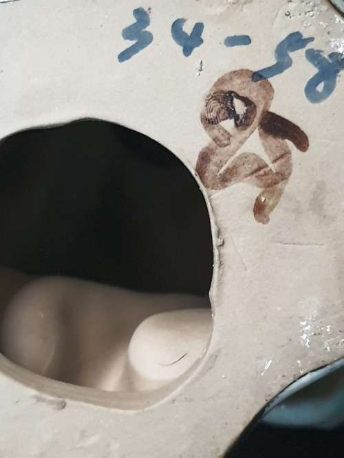 A VINTAGE JAPANESE MUD MAN FIGURINE SOLD AS IS