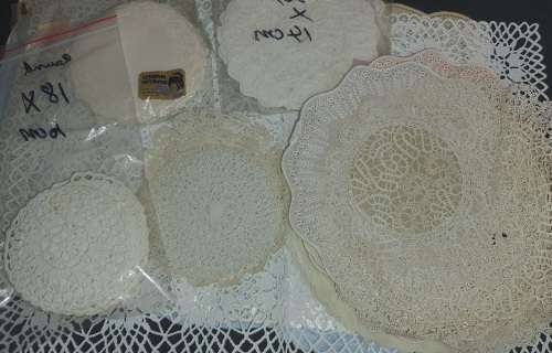 A vintage job lot cotton and Poly plastic doilies and coasters sold as is
