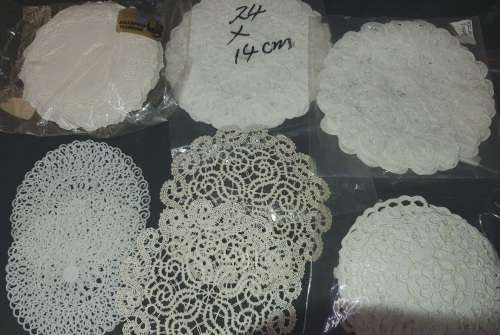 A vintage job lot cotton and Poly plastic doilies and coasters sold as is