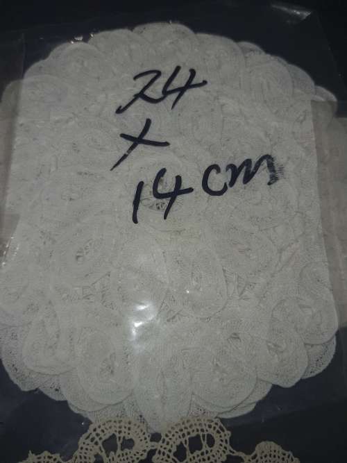 A vintage job lot cotton and Poly plastic doilies and coasters sold as is