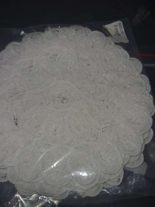 A vintage job lot cotton and Poly plastic doilies and coasters sold as is