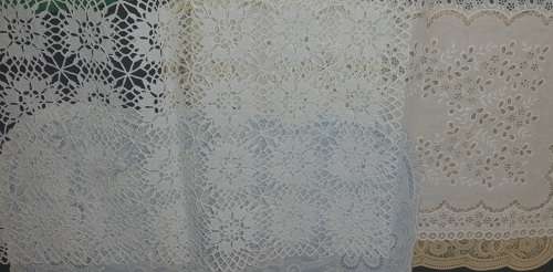 A vintage job lot cotton and Poly plastic doilies and coasters sold as is