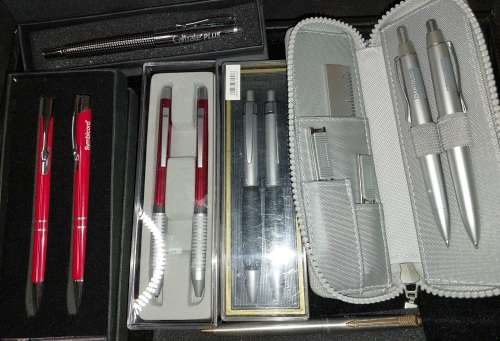 A VINTAGE JOBLOT ROLLER BALL AND PENCIL SETS SOLD AS IS