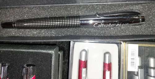 A VINTAGE JOBLOT ROLLER BALL AND PENCIL SETS SOLD AS IS