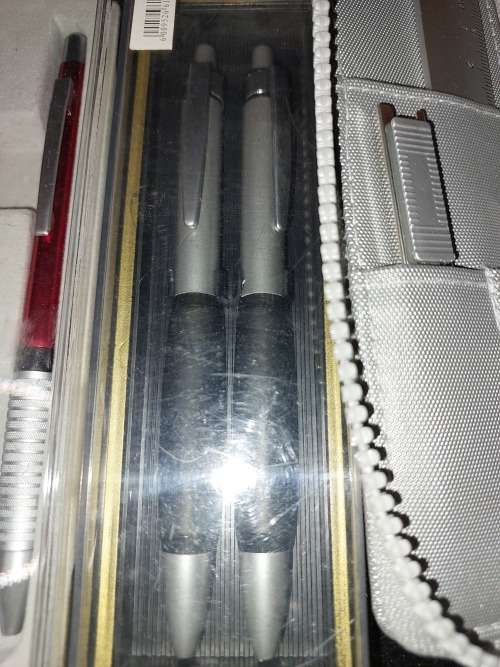 A VINTAGE JOBLOT ROLLER BALL AND PENCIL SETS SOLD AS IS