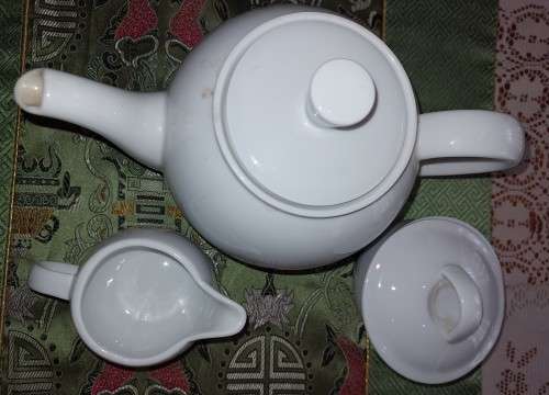 A BOARD MANS TEA JUG, SUGAR BOWL WITH A LID AND A MILK JUG IN GOOD CONDITION SOLD AS IS