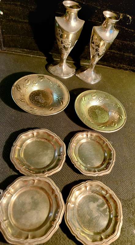 A collection of vintage utensils and a pair of silver-plated candle holders in good condition sold a