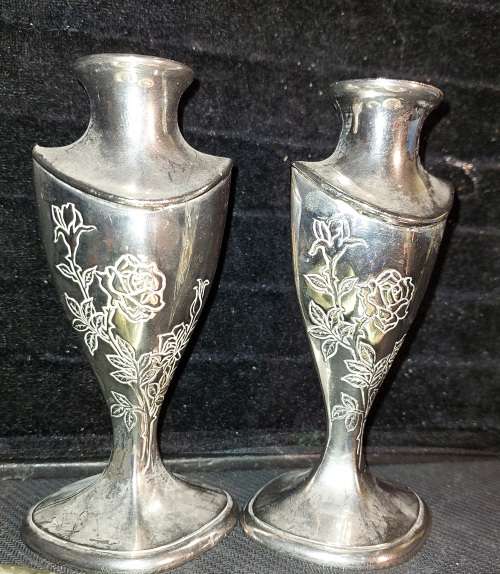 A collection of vintage utensils and a pair of silver-plated candle holders in good condition sold a