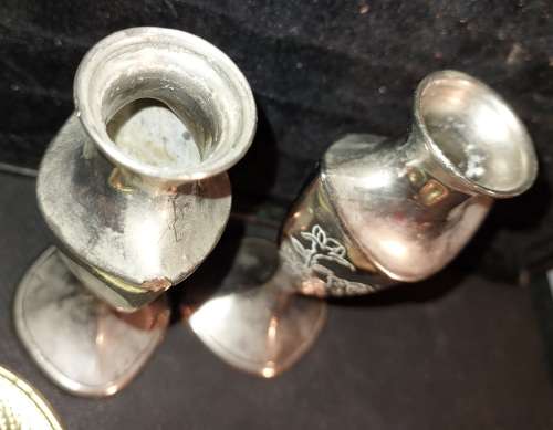 A collection of vintage utensils and a pair of silver-plated candle holders in good condition sold a
