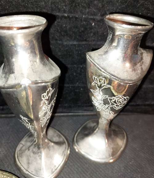 A collection of vintage utensils and a pair of silver-plated candle holders in good condition sold a