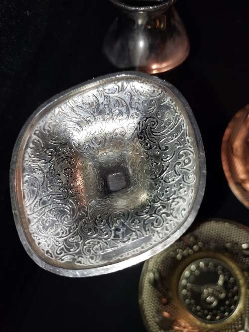 A collection of vintage utensils and a pair of silver-plated candle holders in good condition sold a