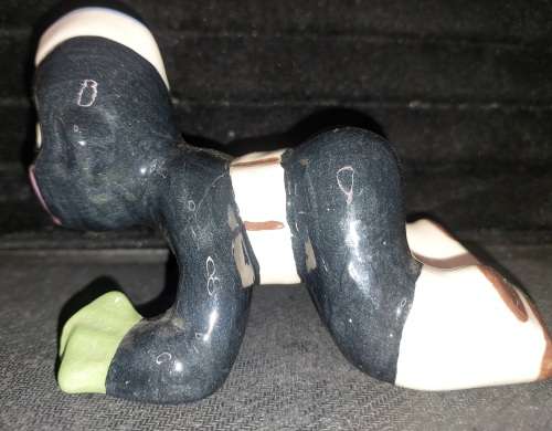 A collection of American folk art ceramic figurines in good condition sold as is