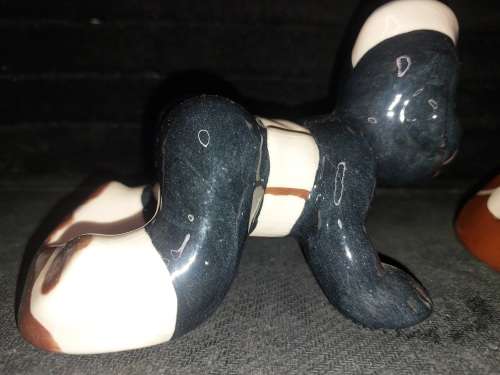 A collection of American folk art ceramic figurines in good condition sold as is