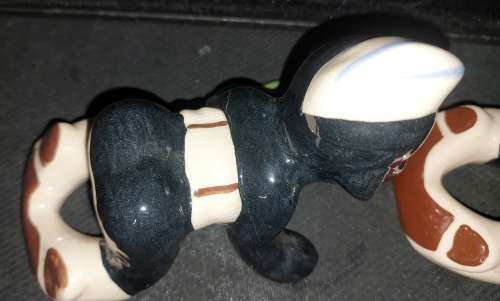 A collection of American folk art ceramic figurines in good condition sold as is