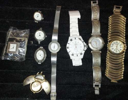 A COLLECTION WOMANS QUARTZ WATCHES SOLD AS IS NOT TESTED