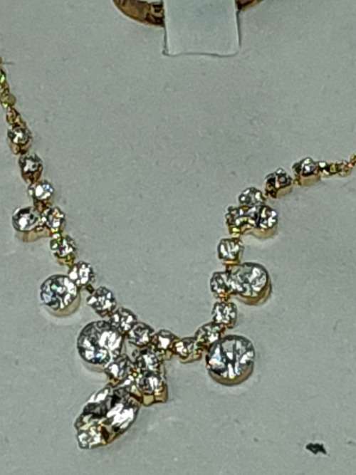 2 PERFACT AND COMPLETE GOLD-PLATED COSTUME JEWELRY SETS BY ROMIL AND AIM SOLD AS IS