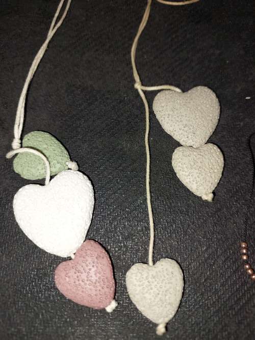 A COLLECTION OF SEA CORAL PENDANT NECKLACES SOLD AS IS