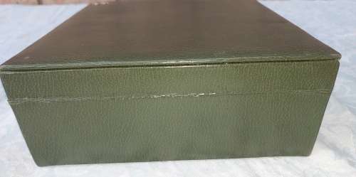 A VINTAGE GREEN LEATHER WITH A GOLD PLATED LETTER M JEWELRY BOX SOLD AS IS