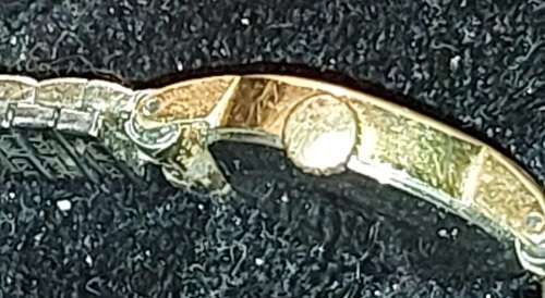 AN ANTIQUE OMEGA WOMANS WATCH SOLD AS IS NOT TESTED