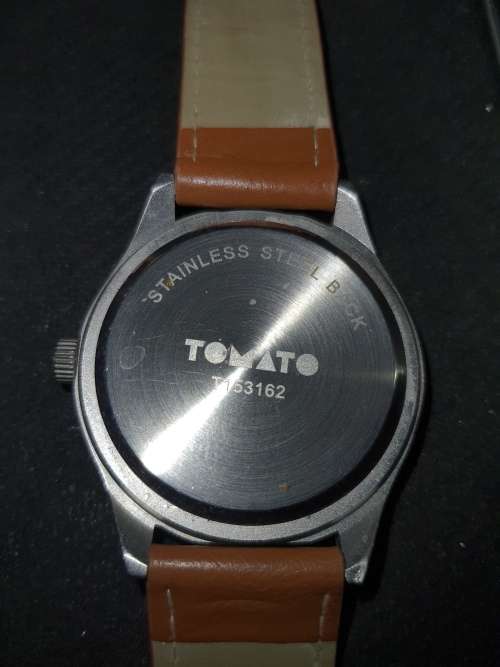 A UNISEX TAMATO WRISTWATCH SOLD AS IS NOT TESTED