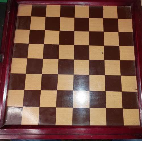 A VINTAGE CHESS BOARD AND STORAGE COMPARTMENT WITH ALL THE PIECES COMPLETE SET PIECES ARE CERAMIC