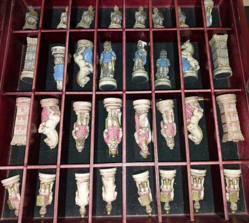 A VINTAGE CHESS BOARD AND STORAGE COMPARTMENT WITH ALL THE PIECES COMPLETE SET PIECES ARE CERAMIC