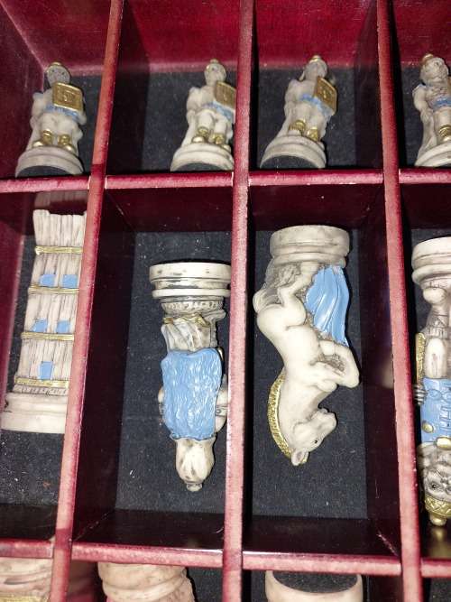 A VINTAGE CHESS BOARD AND STORAGE COMPARTMENT WITH ALL THE PIECES COMPLETE SET PIECES ARE CERAMIC
