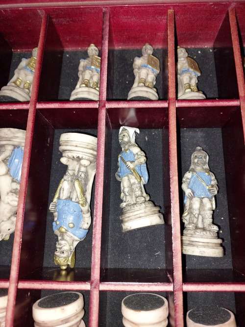A VINTAGE CHESS BOARD AND STORAGE COMPARTMENT WITH ALL THE PIECES COMPLETE SET PIECES ARE CERAMIC